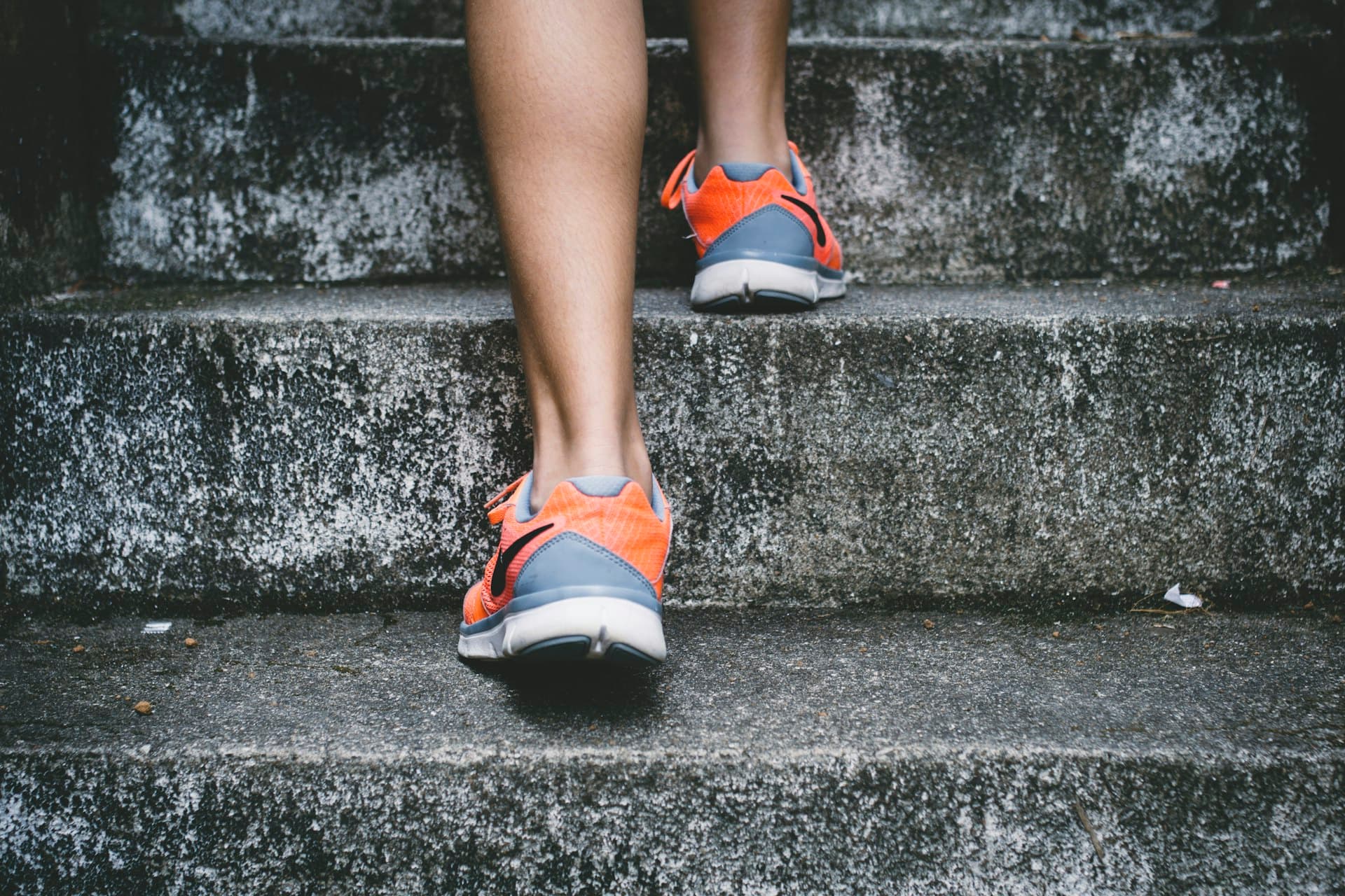 Woman running at sunrise — heart health and vitality