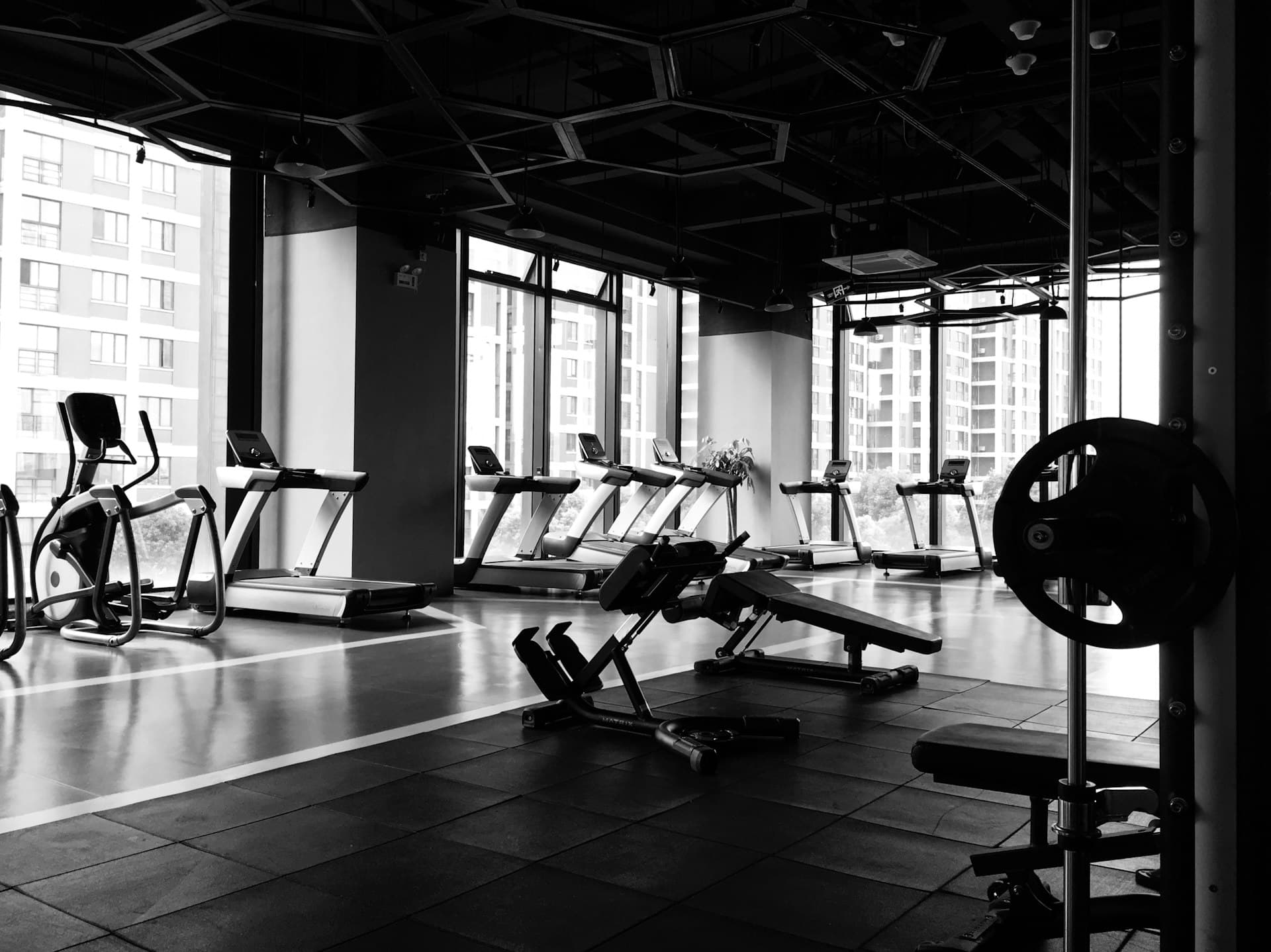 Confident professional in a modern fitness environment